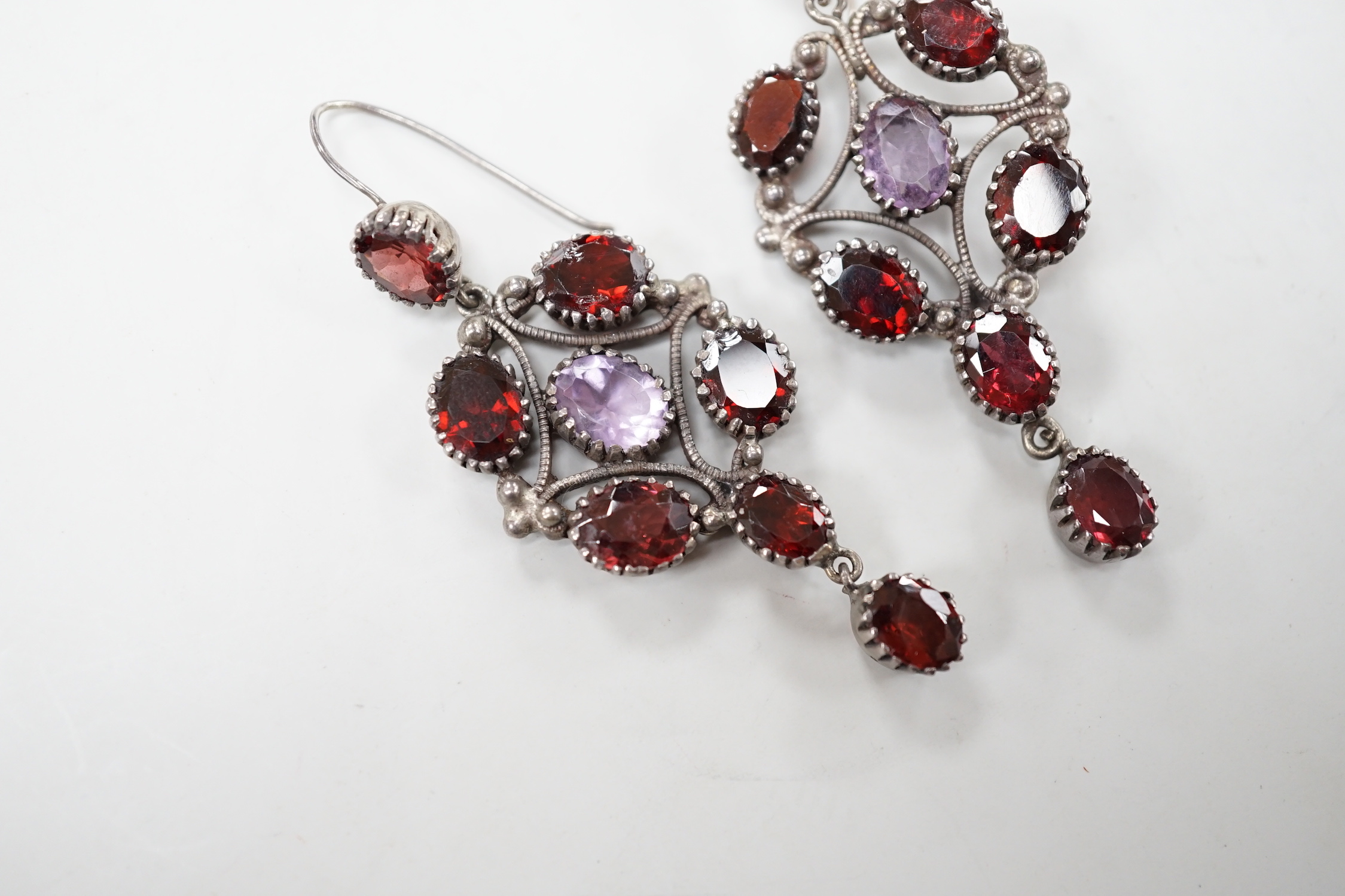 A pair of late 19th/early 20th century white metal and two colour paste cluster set drop earrings, 72mm.